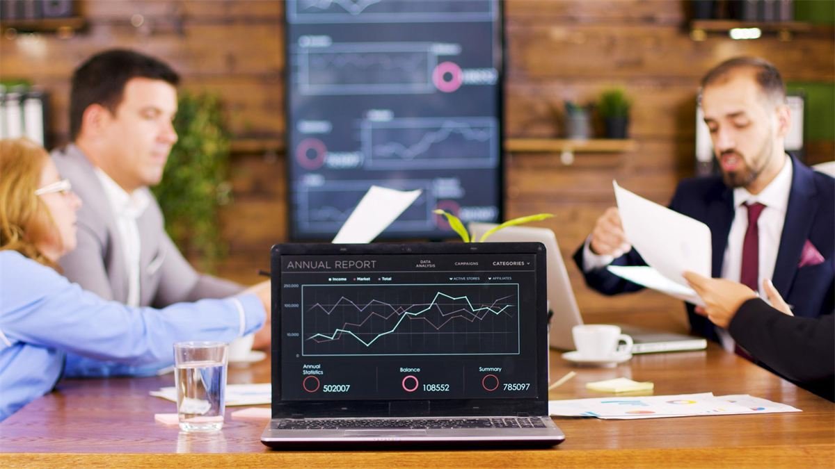 Management reviewing performance on a dashboard